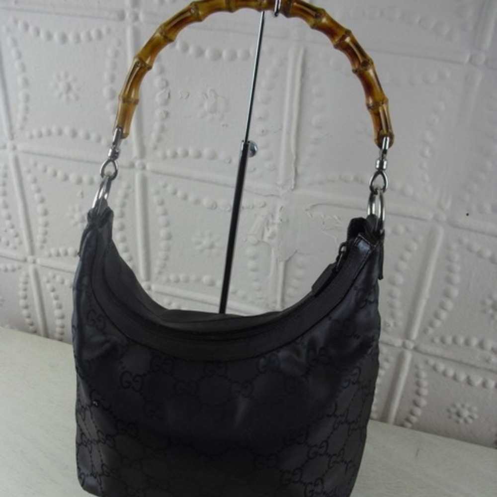 Gucci bamboo handle shoulder bag.